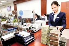 Nếu quy định mới được áp dụng, các ngân hàng thương mại sẽ có thêm điều kiện để phát triển tín dụng. Ảnh: Quế Như