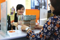 Không dễ thu hút nhà đầu tư nước ngoài mua cổ phiếu ngân hàng Việt Nam. Ảnh: Lê Tiên
