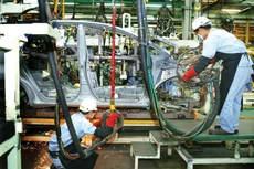 Doanh nghiệp cần đẩy mạnh tái cơ cấu hoạt động, nâng cấp năng lực quản trị, từ đó nâng cao khả năng thích ứng trong bối cảnh mới. Ảnh: Lê Tiên