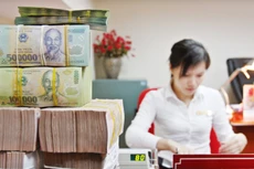 Đến cuối tháng 8/2023, tỷ lệ nợ xấu nội bảng của hệ thống các tổ chức tín dụng là 5,12%. Ảnh: Tường Lâm