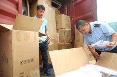 Trong năm 2022, 21 chế độ báo cáo và 478 sản phẩm, hàng hóa kiểm tra chuyên ngành đã được cắt giảm. Ảnh: Lê Tiên