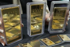 Giá vàng thế giới lập đỉnh trong chín năm trong phiên 21/7. Ảnh: TTXVN phát