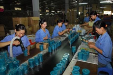 Quốc hội ủng hộ Chính phủ tiếp tục tạo dựng môi trường đầu tư, kinh doanh thuận lợi, minh bạch cho mọi doanh nghiệp. Ảnh: Tiên Giang