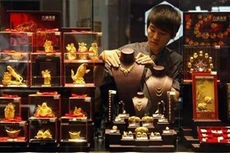 Giá vàng chốt tuần ở 1.250 USD mỗi ounce. Ảnh: Telegraph.