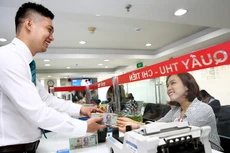 Xử lý nợ xấu là nhân tố quyết định đến sức khỏe của hệ thống ngân hàng trong thời gian tới. Ảnh: Lê Tiên