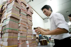Ngân hàng Nhà nước yêu cầu các ngân hàng thương mại công bố chênh lệch lãi suất tiền gửi bình quân và cho vay bình quân. Ảnh: Song Lê