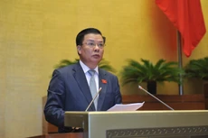 Bộ trưởng Bộ Tài chính Đinh Tiến Dũng, trình bày Tờ trình Dự án Luật quản lý nợ công (sửa đổi).