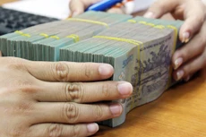 Bộ trưởng Bộ Tài chính Đinh Tiến Dũng cho rằng, đối với vay nợ của DNNN theo cơ chế tự vay tự trả, doanh nghiệp là bên vay có trách nhiệm thực hiện nghĩa vụ trả nợ theo quy định của pháp luật. Ảnh: Tường Lâm