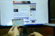 Việc cơ quan thuế tiếp cận tài khoản ngân hàng gây lo ngại về tính bảo mật thông tin cá nhân và bí mật kinh doanh. Ảnh: Nhã Chi