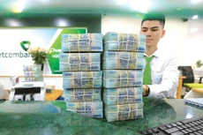 Ngân hàng Nhà nước chỉ đạo các tổ chức tín dụng hướng tín dụng vào những lĩnh vực sản xuất, kinh doanh, lĩnh vực ưu tiên theo chủ trương của Chính phủ. Ảnh: Minh Dũng