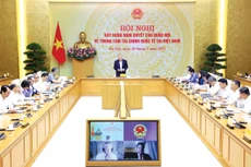 Phó Thủ tướng Thường trực Chính phủ Nguyễn Hòa Bình chủ trì Hội nghị về xây dựng Nghị quyết của Quốc hội về Trung tâm tài chính quốc tế tại Việt Nam. Ảnh: VPG Nguyễn Hoàng