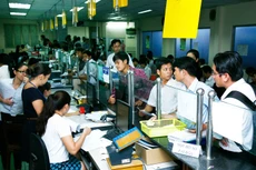 Doanh nghiệp đang đặt nhiều kỳ vọng vào những động thái quyết liệt của Chính phủ. Ảnh: LTT