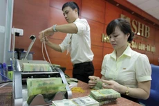 Hai yếu tố tác động lớn nhất đến tỷ giá trong nước là Trung Quốc phá giá nhân dân tệ và Fed tăng lãi suất USD.