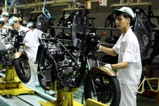 Tạo môi trường kinh doanh minh bạch, rõ ràng sẽ góp phần giải phóng nguồn lực cho phát triển kinh tế - xã hội. Ảnh: Lê Tiên