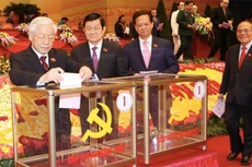 Tổng bí thư Nguyễn Phú Trọng và Chủ tịch nước Trương Tấn Sang là 2 người bỏ phiếu đầu tiên. Ảnh: TTXVN