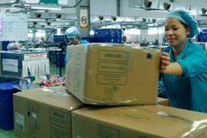 Nhà nước đang thể hiện quyết tâm cải thiện môi trường kinh doanh để doanh nghiệp yên tâm đầu tư sản xuất. Ảnh: Nhã Chi