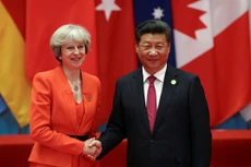 Thủ tướng Anh Theresa May (trái) và Chủ tịch Trung Quốc Tập Cận Bình tại hội nghị G20. Ảnh: Reuters
