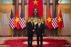 Chủ tịch nước Trần Đại Quang và Tổng thống Barack Obama - Ảnh: Reuters.