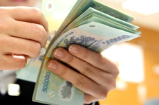 Chi cân đối ngân sách nhà nước năm 2014 còn 26.169 tỷ đồng chưa đủ điều kiện quyết toán. Ảnh: Ngân Hà