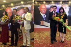 Ông Nguyễn Thế Anh (áo vest đen) và ông Nguyễn Văn Thông (áo vest trắng) trong một hoạt động do công ty tổ chức để thu hút khách hàng - Ảnh: website của công ty Phúc Gia Bảo