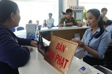 Thu thuế quá nặng gây khó khăn cho doanh nghiệp. Ảnh: Quỳnh Như