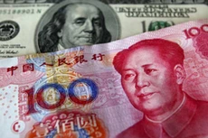 Nhân dân tệ suy yếu trong khi USD đang có xu hướng đi lên. (Ảnh minh họa: Reuters)