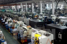 Sản xuất linh kiện xe máy tại Khu công nghiệp Sông Công, Thái Nguyên. (Nguồn: TTXVN)