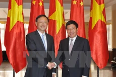 Phó Thủ tướng, Bộ trưởng Ngoại giao Phạm Bình Minh tiếp Ủy viên Quốc vụ Quốc Vụ viện Trung Quốc Dương Khiết Trì. (Ảnh: Nguyễn Khang/TTXVN)