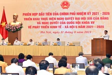 Phó Thủ tướng Chính phủ Lê Minh Khái trình bày Báo cáo về các nhiệm vụ, giải pháp trọng tâm của Chính phủ nhiệm kỳ 2021-2026 triển khai thực hiện Nghị quyết Đại hội XIII của Đảng và Nghị quyết Quốc hội về kế hoạch phát triển kinh tế - xã hội 5 năm 2021-2025. Ảnh: VGP