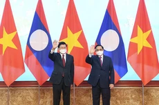 Thủ tướng Chính phủ Phạm Minh Chính và Tổng Bí thư, Chủ tịch nước Cộng hòa dân chủ nhân dân Lào Thongloun Sisoulith - Ảnh: VGP
