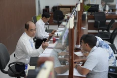 Công chức TP. Đà Nẵng làm việc tại Trung tâm phục vụ hành chính công, khi thành phố vận hành thử chính quyền hai cấp