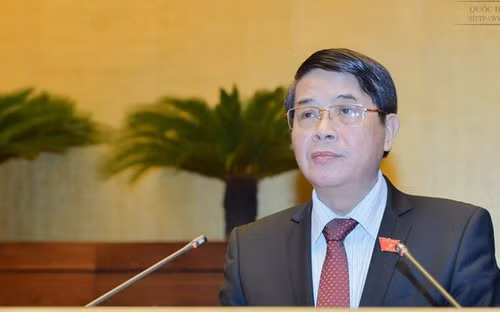 Chủ nhiệm Uỷ ban Tài chính - Ngân sách Nguyễn Đức Hải trình bày báo cáo thẩm tra dự án Luật Quản lý nợ công (sửa đổi).