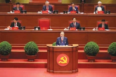 Tổng Bí thư Tô Lâm, Trưởng Tiểu ban Văn kiện, trình bày Báo cáo của Ban Chấp hành Trung ương Đảng khóa XIII về các văn kiện Đại hội. Ảnh: Quý Bắc